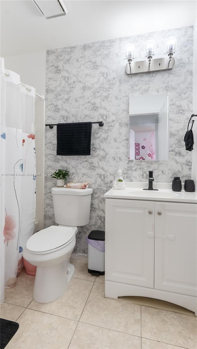 1797 SW Hampshire Ln, Port St Lucie, FL 34953 - bathroom with vanity, toilet, tile patterned floors, and curtained shower