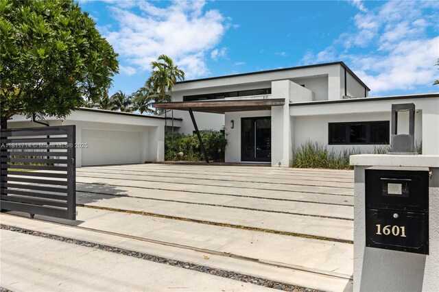 1601 Diplomat Pkwy, Hollywood, FL 33019 - contemporary home featuring stucco siding and a garage