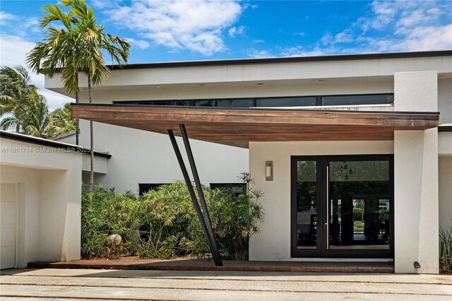 1601 Diplomat Pkwy, Hollywood, FL 33019 - entrance to property with stucco siding and french doors
