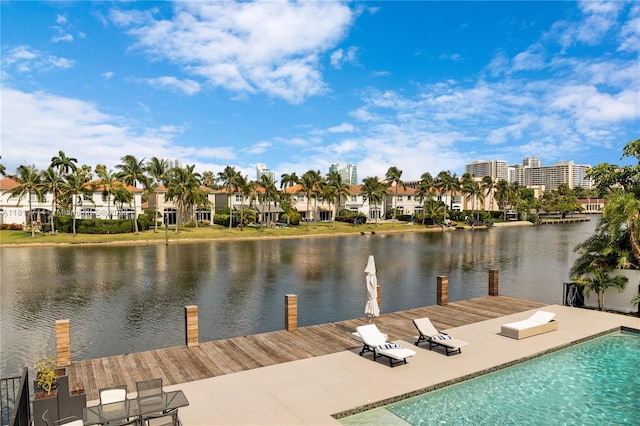 1601 Diplomat Pkwy, Hollywood, FL 33019 - dock area with a water view, an outdoor pool, a patio area, and a residential view