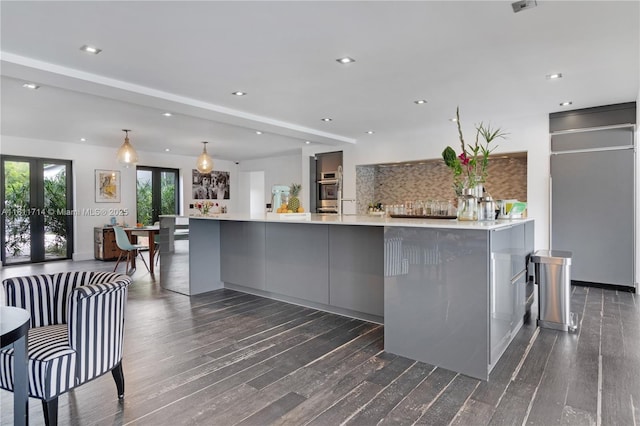 1601 Diplomat Pkwy, Hollywood, FL 33019 - kitchen featuring gray cabinetry, dark wood-style floors, tasteful backsplash, modern cabinets, and recessed lighting
