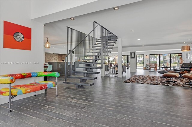 1601 Diplomat Pkwy, Hollywood, FL 33019 - exercise room with a towering ceiling, wood finished floors, and recessed lighting
