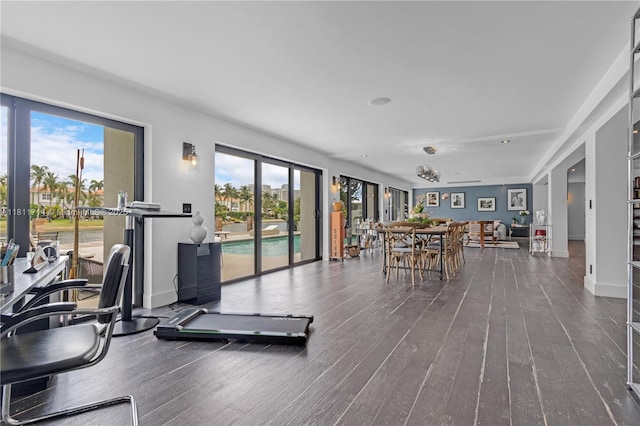 1601 Diplomat Pkwy, Hollywood, FL 33019 - workout area featuring healthy amount of natural light, wood finished floors, and baseboards