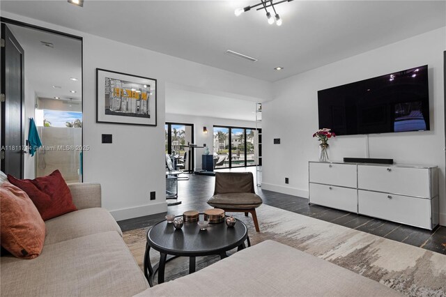 1601 Diplomat Pkwy, Hollywood, FL 33019 - living room featuring baseboards and wood finished floors