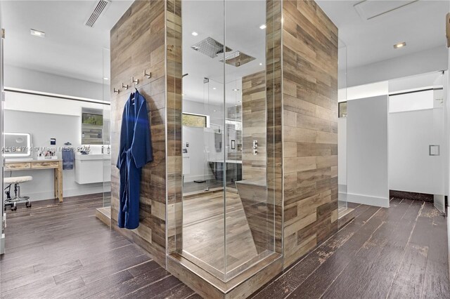 1601 Diplomat Pkwy, Hollywood, FL 33019 - bathroom with hardwood / wood-style floors, a stall shower, and vanity