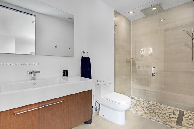1601 Diplomat Pkwy, Hollywood, FL 33019 - bathroom with toilet, a shower stall, vanity, tile patterned floors, and recessed lighting