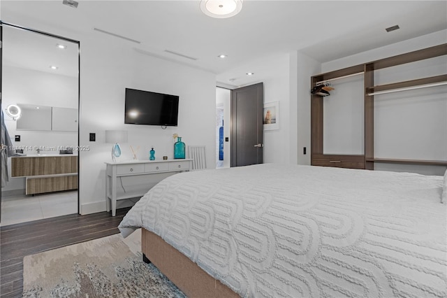 1601 Diplomat Pkwy, Hollywood, FL 33019 - bedroom featuring wood finished floors, recessed lighting, and baseboards