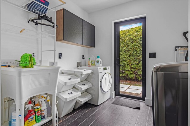 1601 Diplomat Pkwy, Hollywood, FL 33019 - laundry room with cabinet space, washer / dryer, and dark wood-type flooring
