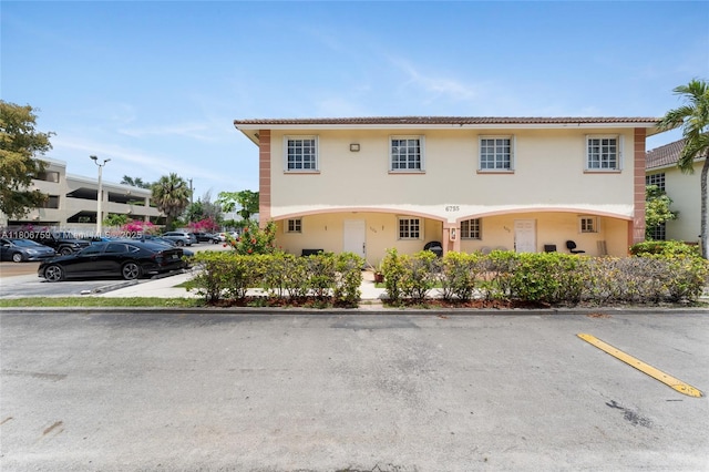 6755 NW 182nd St Unit 104, Hialeah, FL 33015 - mediterranean / spanish-style house featuring uncovered parking and stucco siding