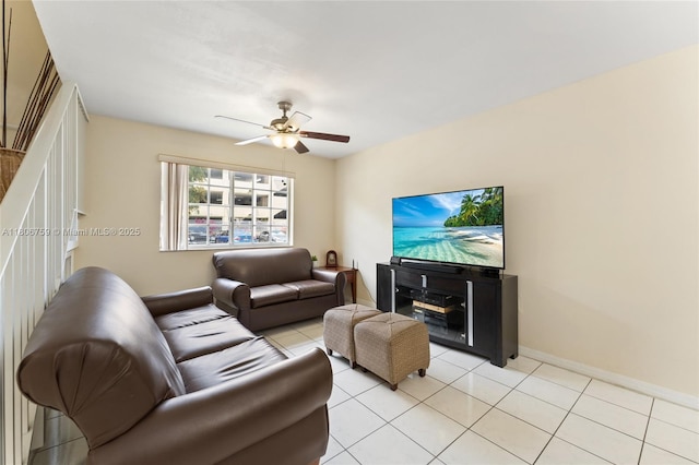 6755 NW 182nd St Unit 104, Hialeah, FL 33015 - living area featuring a ceiling fan, baseboards, and light tile patterned floors