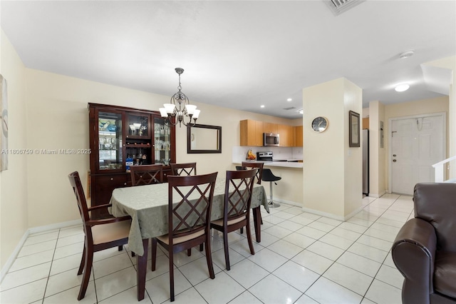 6755 NW 182nd St Unit 104, Hialeah, FL 33015 - dining space featuring a chandelier, light tile patterned flooring, baseboards, and recessed lighting