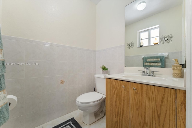 6755 NW 182nd St Unit 104, Hialeah, FL 33015 - bathroom with tile walls, vanity, toilet, tile patterned flooring, and wainscoting