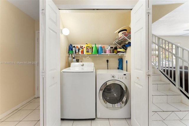 6755 NW 182nd St Unit 104, Hialeah, FL 33015 - washroom featuring washing machine and dryer, light tile patterned floors, and baseboards