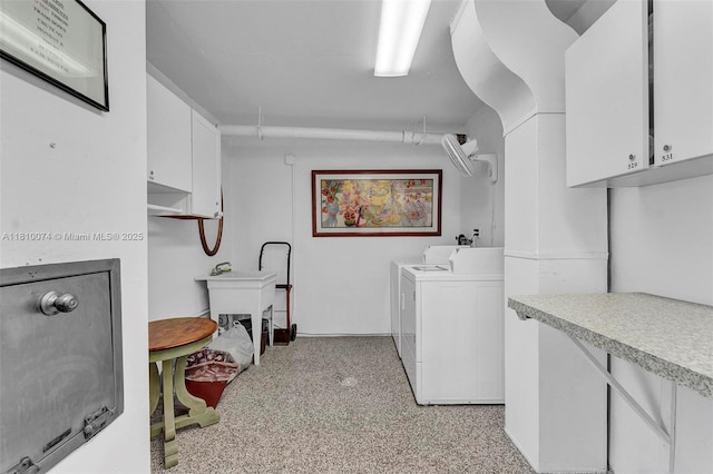 2525 Florida Blvd Unit 530, Delray Beach, FL 33483 - washroom with separate washer and dryer, cabinet space, and light colored carpet