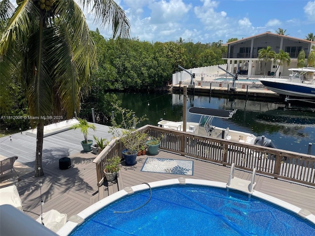 894 Ellen Dr, Key Largo, FL 33037 - swimming pool featuring a deck with water view and a boat dock