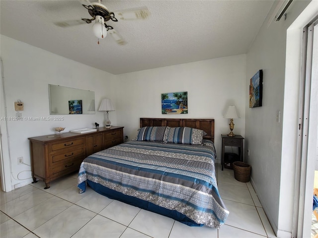 15600 NE 6th Ave Unit 33A, Miami, FL 33162 - bedroom with light tile patterned floors, a ceiling fan, and a textured ceiling