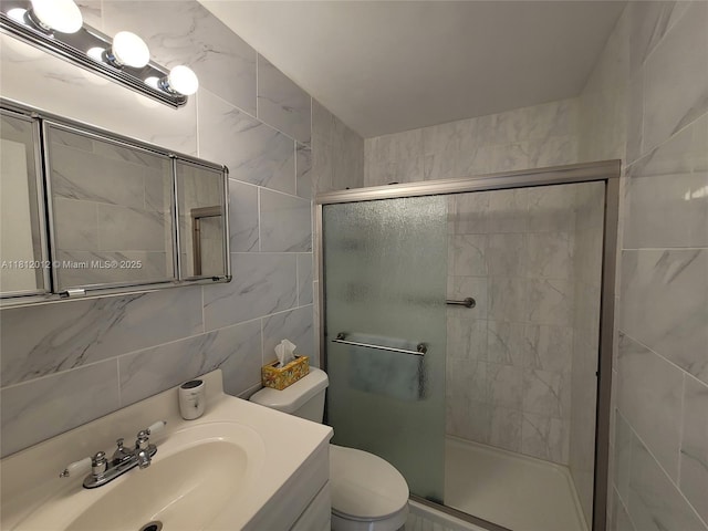 15600 NE 6th Ave Unit 33A, Miami, FL 33162 - bathroom featuring a stall shower, vanity, toilet, and tile walls