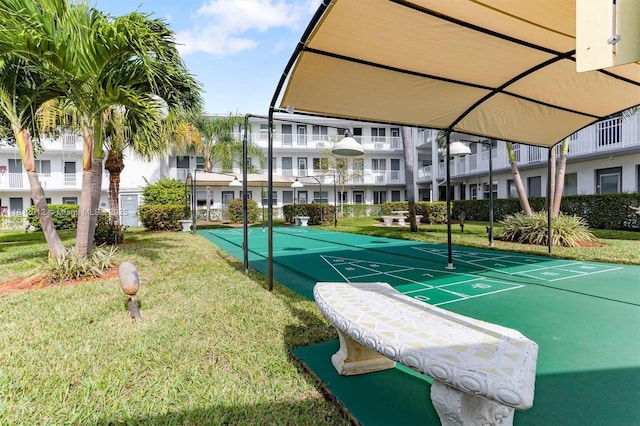 15600 NE 6th Ave Unit 33A, Miami, FL 33162 - surrounding community with a yard and shuffleboard