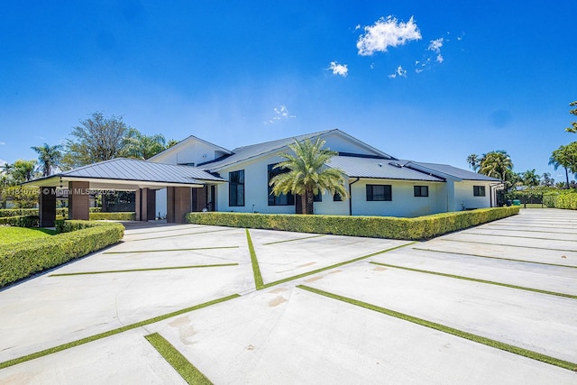 10506 SW 89th Pl, Miami, FL 33176 - view of front of property featuring driveway, a standing seam roof, and metal roof