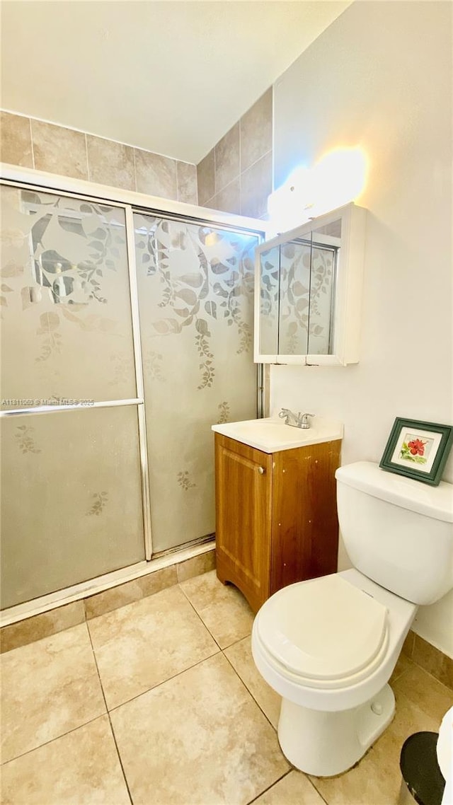 580 NE 139th St, North Miami, FL 33161 - full bath with toilet, vanity, a shower stall, and tile patterned floors