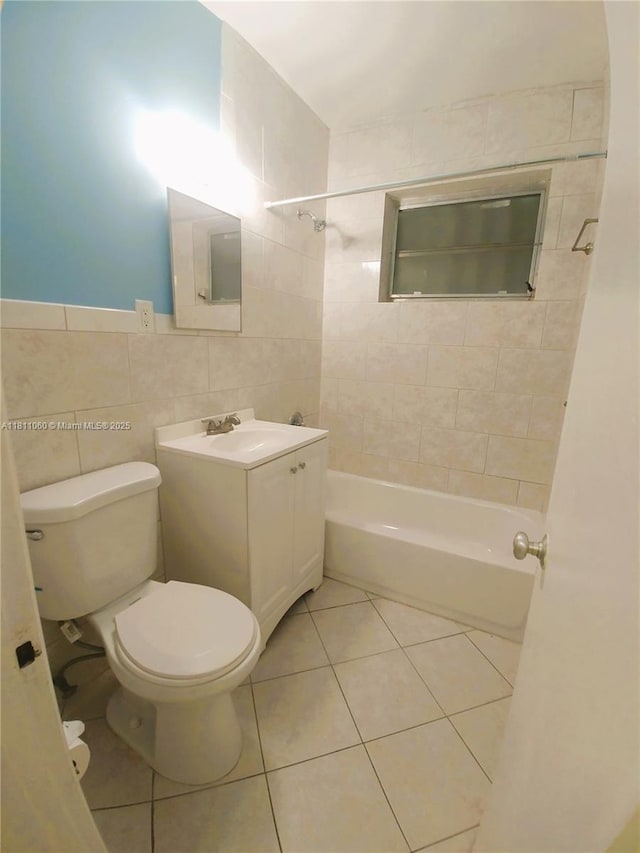 580 NE 139th St, North Miami, FL 33161 - bathroom featuring toilet, tile walls, shower / washtub combination, vanity, and tile patterned floors