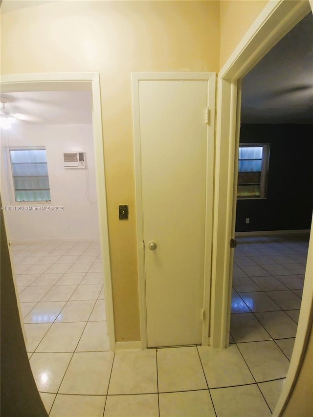 580 NE 139th St, North Miami, FL 33161 - corridor featuring light tile patterned flooring and a wall mounted AC