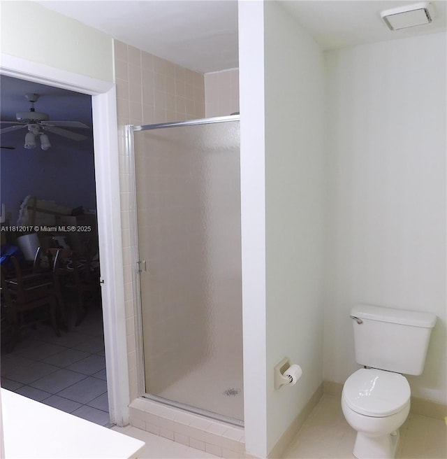 10823 SW 147th Ct, Miami, FL 33196 - bathroom with a shower stall, toilet, a ceiling fan, and tile patterned flooring