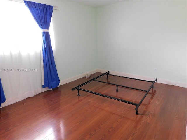 10823 SW 147th Ct, Miami, FL 33196 - unfurnished bedroom featuring wood finished floors and baseboards