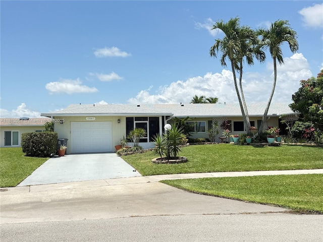 13097 Via Minerva, Delray Beach, FL 33484 - single story home featuring an attached garage, concrete driveway, and a front lawn