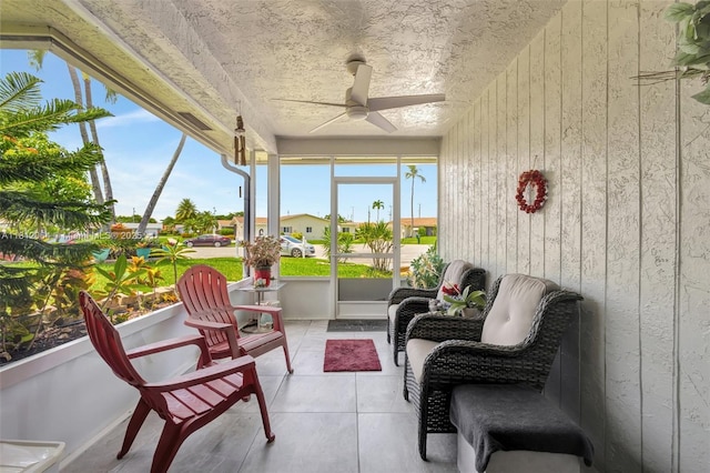 13097 Via Minerva, Delray Beach, FL 33484 - sunroom / solarium with ceiling fan, a residential view, and tile patterned flooring