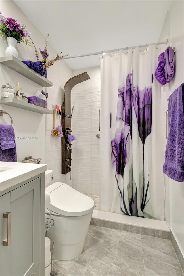 13097 Via Minerva, Delray Beach, FL 33484 - full bath with a tile shower, toilet, vanity, and baseboards