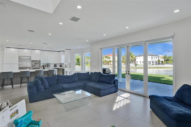 16880 SW 49th Ct, Miramar, FL 33027 - living area with recessed lighting, french doors, and light tile patterned floors