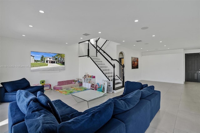 16880 SW 49th Ct, Miramar, FL 33027 - living area featuring arched walkways, stairway, light tile patterned floors, and recessed lighting