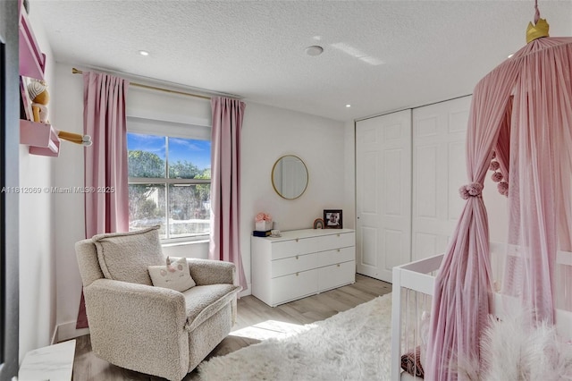 16880 SW 49th Ct, Miramar, FL 33027 - bedroom featuring a textured ceiling, light wood-style floors, a closet, and recessed lighting