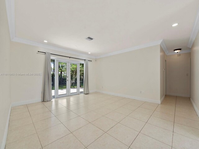 12531 SW 37th Ter, Miami, FL 33175 - spare room with crown molding, baseboards, light tile patterned floors, and recessed lighting