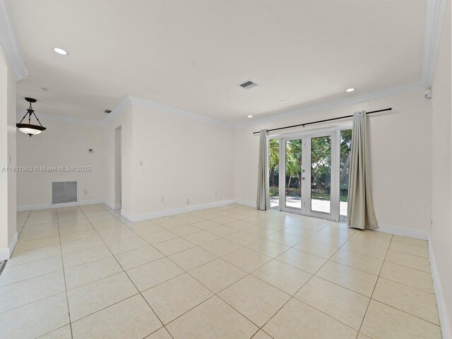 12531 SW 37th Ter, Miami, FL 33175 - unfurnished living room featuring light tile patterned floors, ornamental molding, baseboards, french doors, and recessed lighting