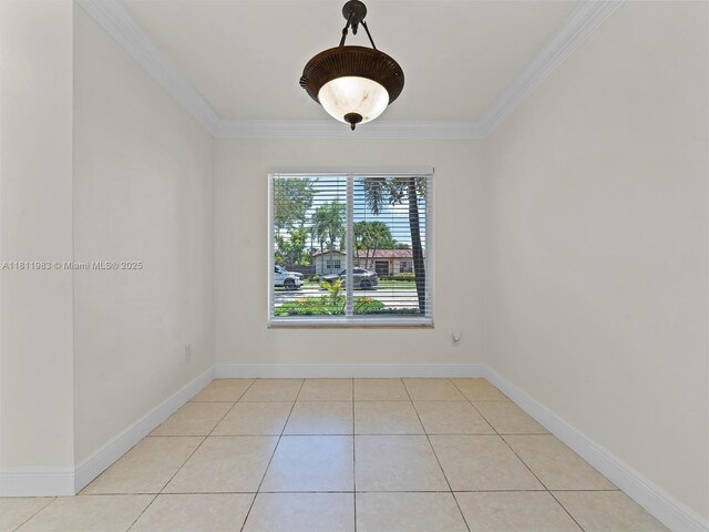 12531 SW 37th Ter, Miami, FL 33175 - spare room with ornamental molding, light tile patterned floors, and baseboards