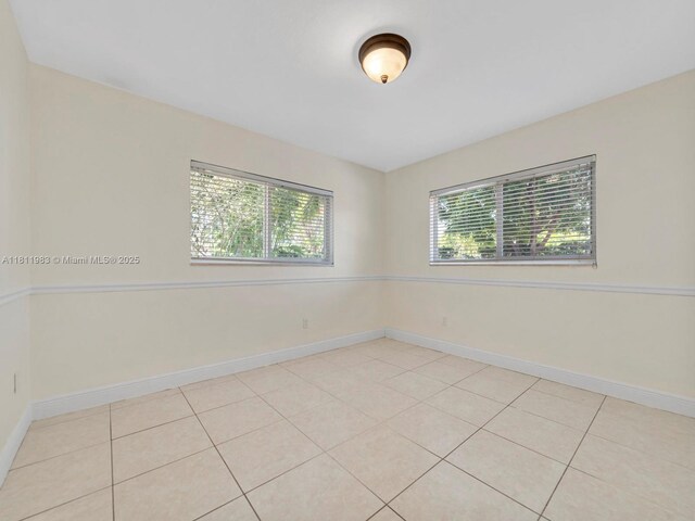 12531 SW 37th Ter, Miami, FL 33175 - walk in closet featuring light tile patterned floors