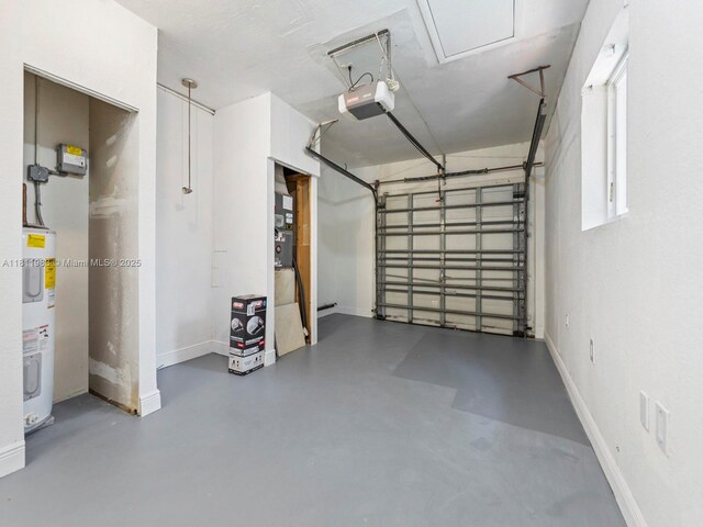 12531 SW 37th Ter, Miami, FL 33175 - garage featuring electric water heater, a garage door opener, and baseboards