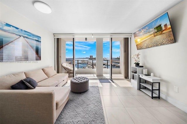 555 NE 15th St Unit 516, Miami, FL 33132 - tiled living room with floor to ceiling windows and baseboards