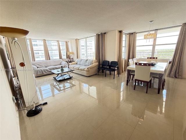 18051 Biscayne Blvd Unit 1505, Aventura, FL 33160 - living area with a textured ceiling, plenty of natural light, and tile patterned flooring