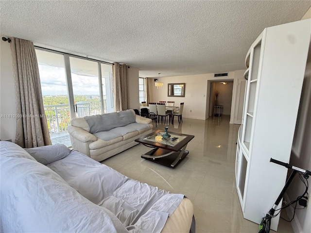18051 Biscayne Blvd Unit 1505, Aventura, FL 33160 - living area featuring a textured ceiling and light tile patterned floors