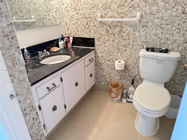 18051 Biscayne Blvd Unit 1505, Aventura, FL 33160 - bathroom featuring vanity, toilet, tile walls, and tile patterned floors