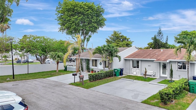 5651 SW 139th Pl, Miami, FL 33183 - ranch-style home with stucco siding, a front lawn, and a shingled roof