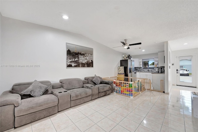 5651 SW 139th Pl, Miami, FL 33183 - living room with light tile patterned floors, ceiling fan, lofted ceiling, and recessed lighting