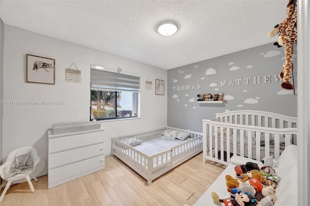 5651 SW 139th Pl, Miami, FL 33183 - bedroom featuring a textured ceiling and wood finished floors