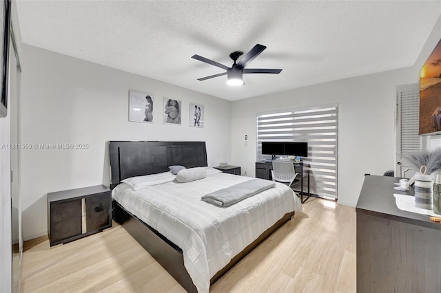 5651 SW 139th Pl, Miami, FL 33183 - bedroom featuring light wood-style floors, a textured ceiling, baseboards, and a ceiling fan