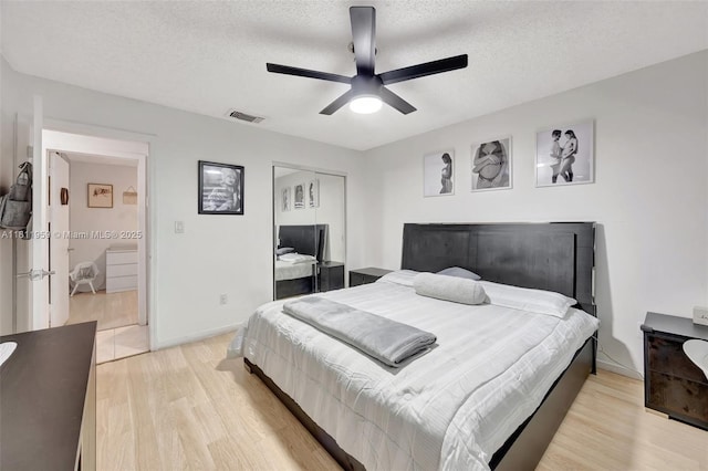 5651 SW 139th Pl, Miami, FL 33183 - bedroom with light wood-style flooring, a closet, a textured ceiling, ceiling fan, and baseboards