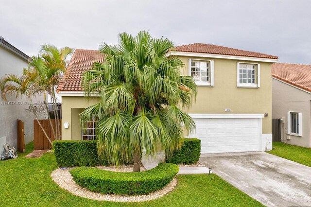 7251 SW 158th Pl, Miami, FL 33193 - mediterranean / spanish-style house featuring a tiled roof, an attached garage, driveway, and stucco siding