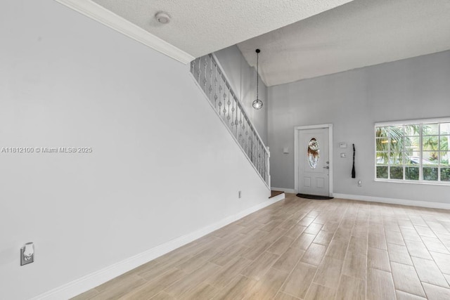 7251 SW 158th Pl, Miami, FL 33193 - entryway with stairway, a textured ceiling, and light wood finished floors